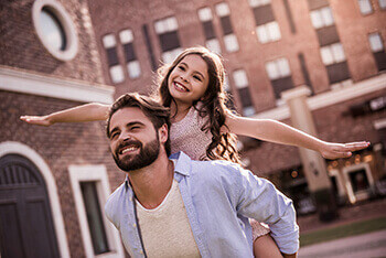 Man Happy With Daughter after Eye Muscle Surgery
