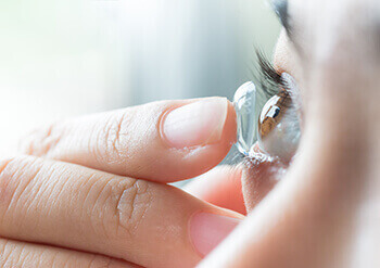 Woman Putting in Contacts